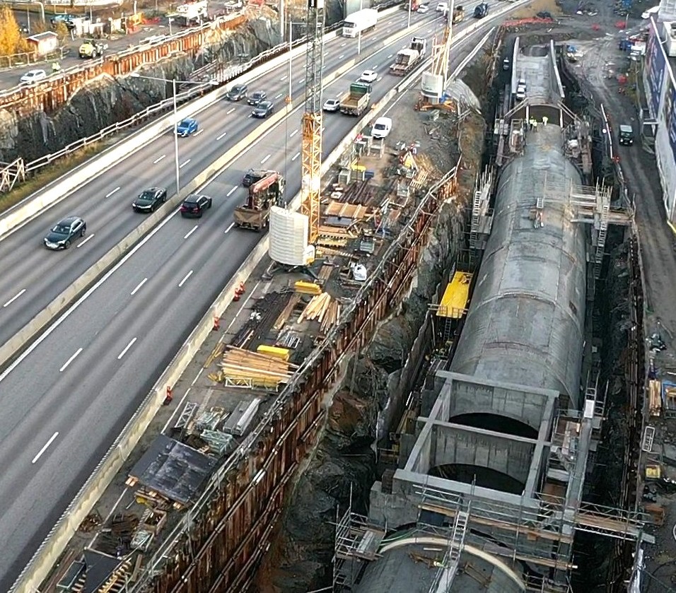 Aerial view of tunnel construction beside an active road