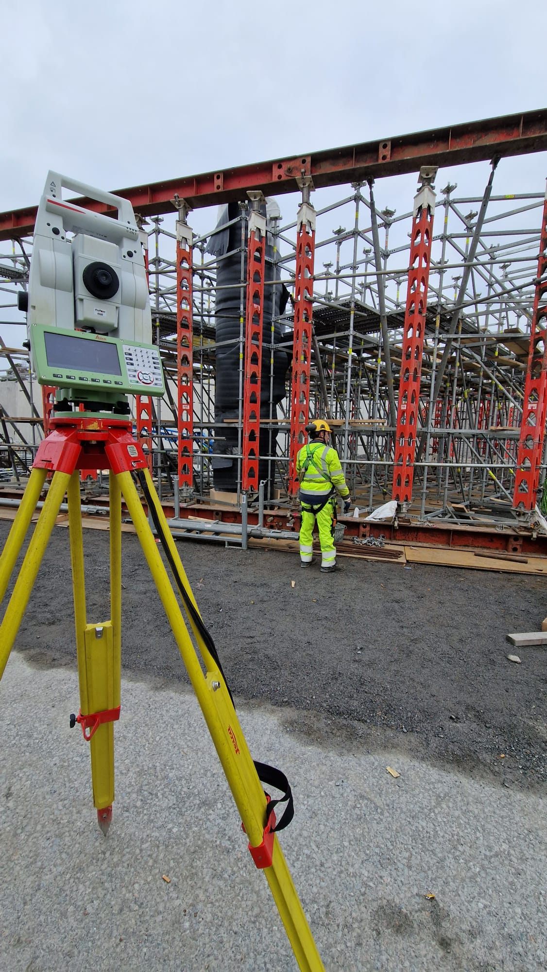 Total station beside bridge formwork and supports